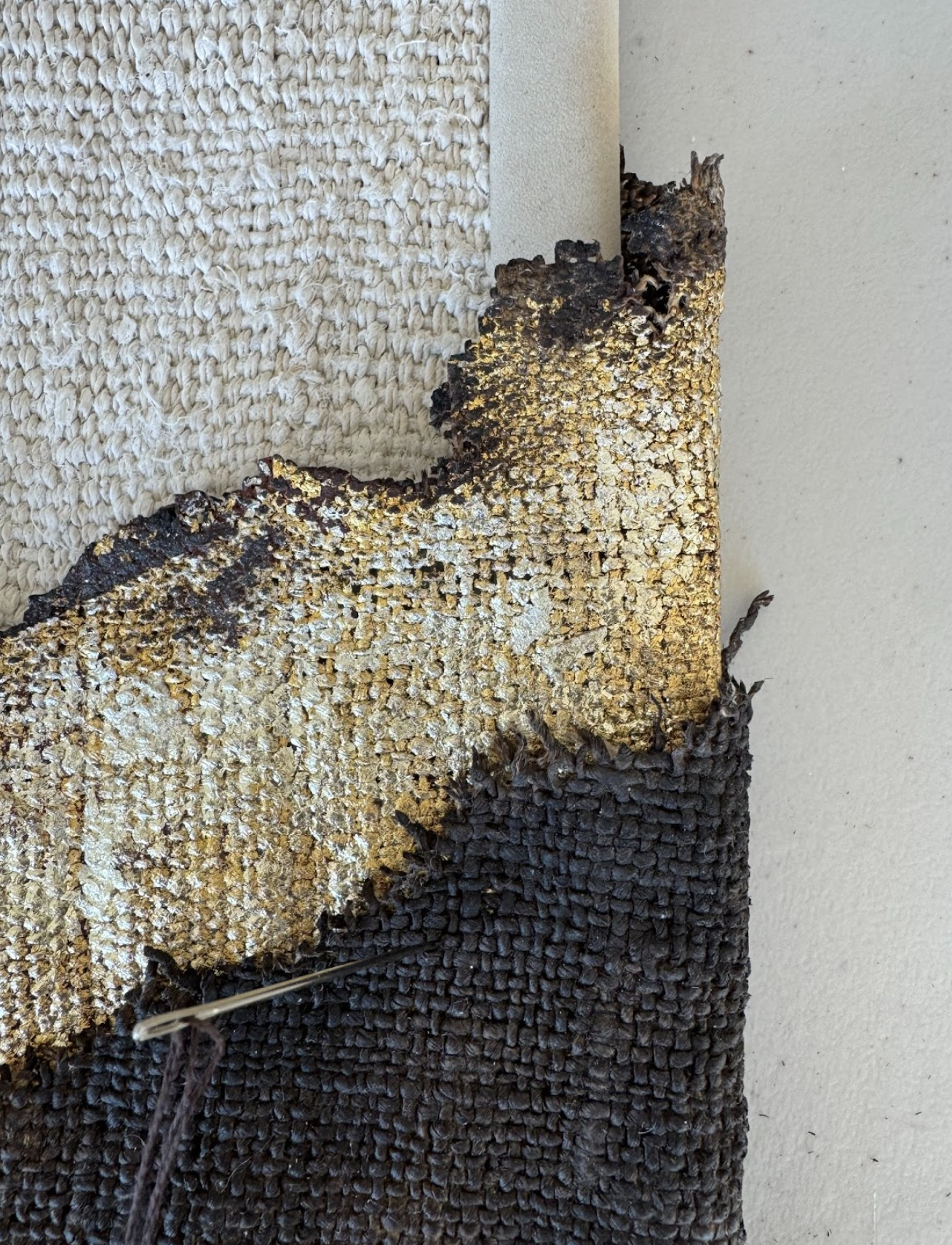 Detail of current work by Laura Nacke/Laura Roberts.  Landscape of Blessings, textile art gold leaf, burned fabric